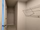 Compact walk-in closet with wire shelving and neutral carpet at 1710 Summer Rose Dr, Mount Dora, FL 32757