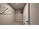 Small walk-in closet with white wire shelving and an open design at 1710 Summer Rose Dr, Mount Dora, FL 32757