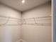 Walk-in closet with white wire shelving for ample storage and organization at 1710 Summer Rose Dr, Mount Dora, FL 32757