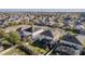 Aerial view of a house featuring solar panels, a pool, and a screened patio at 1741 Bonser Rd, Minneola, FL 34715