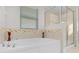 Relaxing bathroom with soaking tub and walk-in shower at 1741 Bonser Rd, Minneola, FL 34715