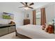 Cozy bedroom with double bed, dresser, and TV at 1741 Bonser Rd, Minneola, FL 34715