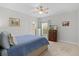 Bright bedroom with a comfortable bed and ample closet space at 1741 Bonser Rd, Minneola, FL 34715