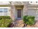 Front entrance with stone columns and landscaping at 1741 Bonser Rd, Minneola, FL 34715