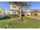 Two-story house with a landscaped yard and brick driveway at 1741 Bonser Rd, Minneola, FL 34715