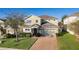 Two-story house with landscaping and brick driveway at 1741 Bonser Rd, Minneola, FL 34715