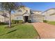 Two-story house with landscaping and brick driveway at 1741 Bonser Rd, Minneola, FL 34715