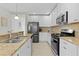 Bright kitchen featuring stainless steel appliances and granite countertops at 1741 Bonser Rd, Minneola, FL 34715