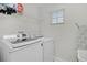 Laundry room with washer, dryer, and shelving at 1741 Bonser Rd, Minneola, FL 34715