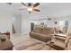Open living room with reclining sofas and view to kitchen at 1741 Bonser Rd, Minneola, FL 34715