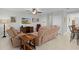 Spacious living room with reclining sofas and ceiling fan at 1741 Bonser Rd, Minneola, FL 34715