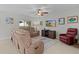 Comfortable living room with reclining sofas and ceiling fan at 1741 Bonser Rd, Minneola, FL 34715