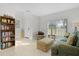 Living room with bookcase, sofa, and armchair at 1741 Bonser Rd, Minneola, FL 34715