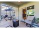 Relaxing screened porch with seating and outdoor table at 1741 Bonser Rd, Minneola, FL 34715