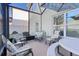 Screened porch with seating area and outdoor table at 1741 Bonser Rd, Minneola, FL 34715