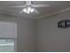 Neutral bedroom featuring a ceiling fan and an entertainment center mount at 1761 12Th St, Orange City, FL 32763