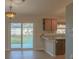 Open concept kitchen with modern cabinets, a breakfast bar, and natural light at 1761 12Th St, Orange City, FL 32763