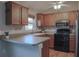 Well-equipped kitchen featuring stainless steel appliances, ample counter space, and wood cabinets at 1761 12Th St, Orange City, FL 32763
