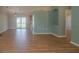 Spacious living room with hardwood floors, large sliding glass doors, and an open layout at 1761 12Th St, Orange City, FL 32763