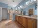 Bathroom features a double vanity, glass shower, and tile flooring at 1828 Feliciana Ter, The Villages, FL 32162