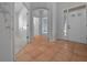 Welcoming foyer features tile flooring, and neutral decor with views of main entry at 1828 Feliciana Ter, The Villages, FL 32162
