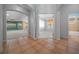 Inviting foyer with tile flooring, views into living spaces, and decorative wall accents at 1828 Feliciana Ter, The Villages, FL 32162