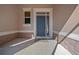 Stylish front entry with a blue door, sidelight, and decorative stone accents at 1828 Feliciana Ter, The Villages, FL 32162