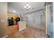 Well-equipped kitchen with black appliances and an eat-in bar overlooking the living room at 1828 Feliciana Ter, The Villages, FL 32162