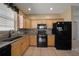 A full view of the kitchen with stainless steel appliances and tile backsplash at 1828 Feliciana Ter, The Villages, FL 32162