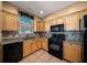 Well-lit kitchen with tile backsplash, granite countertops, and stainless steel appliances at 1828 Feliciana Ter, The Villages, FL 32162