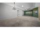 Spacious living room with tray ceilings, neutral carpet, and stylish chandelier at 1828 Feliciana Ter, The Villages, FL 32162