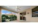 Relaxing screened patio with lush landscaping offering privacy and shade at 1828 Feliciana Ter, The Villages, FL 32162