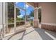 Relaxing screened patio with view of landscaped front yard and neighborhood street at 1828 Feliciana Ter, The Villages, FL 32162