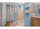 Bathroom shower with glass door enclosure at 1828 Feliciana Ter, The Villages, FL 32162