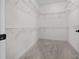 Walk-in closet offering ample storage space with wire shelving at 1828 Feliciana Ter, The Villages, FL 32162