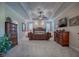 Elegant main bedroom featuring a king-size bed and abundant natural light at 1877 Quailey Ct, The Villages, FL 32163