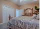 Charming bedroom with a queen-size bed and plenty of closet space at 1877 Quailey Ct, The Villages, FL 32163