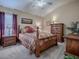 Well-lit bedroom with a queen-size bed and warm color palette at 1877 Quailey Ct, The Villages, FL 32163