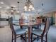 Casual dining area with wooden table and chairs near the kitchen at 1877 Quailey Ct, The Villages, FL 32163