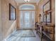 Bright and spacious entryway with hardwood floors and decorative accents at 1877 Quailey Ct, The Villages, FL 32163