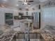 Well-equipped kitchen with granite countertops and an island at 1877 Quailey Ct, The Villages, FL 32163