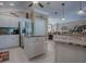 Spacious kitchen with granite countertops, stainless steel appliances, and white cabinets at 1877 Quailey Ct, The Villages, FL 32163