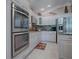 Modern kitchen with stainless steel appliances and granite countertops at 1877 Quailey Ct, The Villages, FL 32163