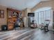 Home office with wood flooring, large window, and ample storage at 1877 Quailey Ct, The Villages, FL 32163