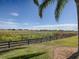 Scenic view of a lake or marsh beyond a wooden fence at 1877 Quailey Ct, The Villages, FL 32163