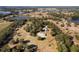 Aerial view of property near a lake at 20020 County Road 33, Groveland, FL 34736