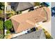 Aerial shot of a home's roof showing landscaping and features, surrounded by other homes in the neighborhood at 2169 Smoaks St, The Villages, FL 32162