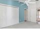 Bedroom features neutral carpet, closet space, access to bathroom and doors to other rooms at 2169 Smoaks St, The Villages, FL 32162