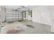 Spacious garage with ample room for parking and storage, featuring a clean and functional layout at 2169 Smoaks St, The Villages, FL 32162