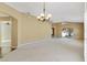 Large living room with ample natural light and neutral decor, ready for personalization at 2169 Smoaks St, The Villages, FL 32162